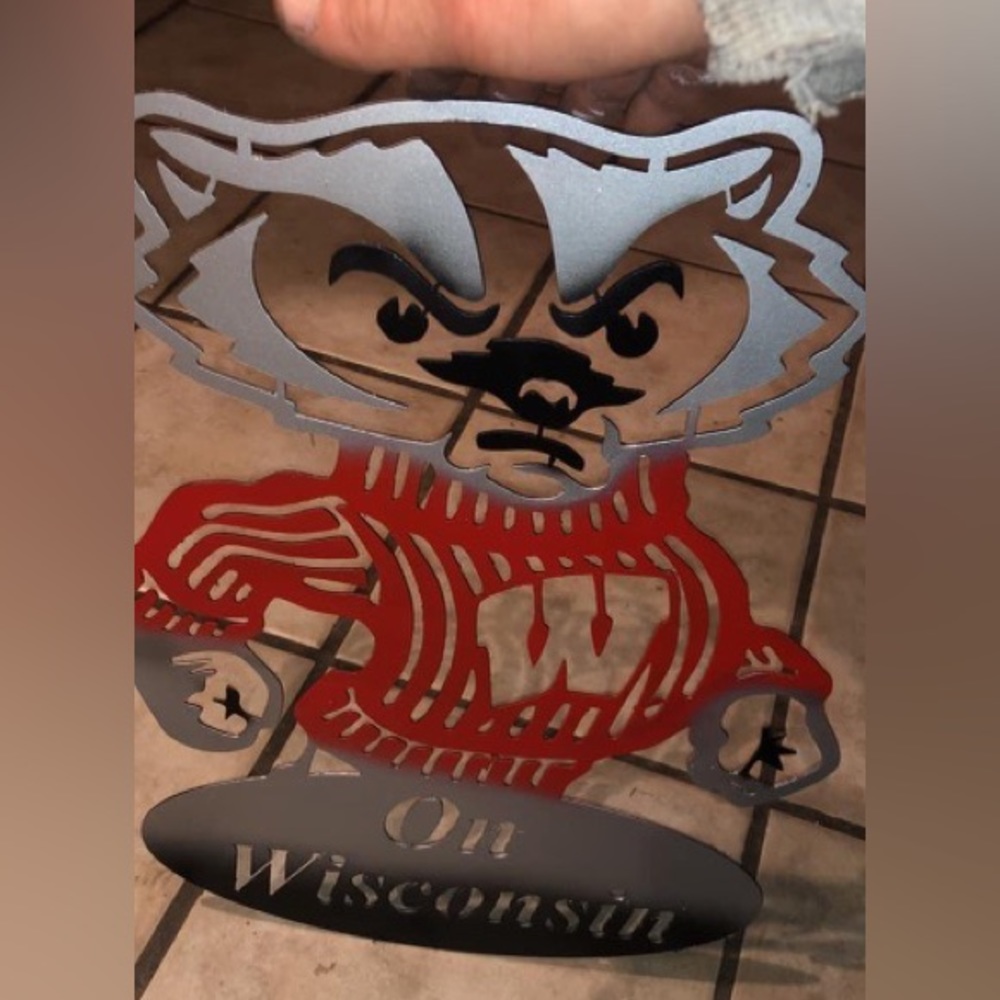 Homemade 1/16” thick Bucky Badger Wall Art with a airbrush matte finish.